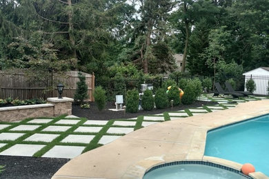 This is an example of a medium sized classic back full sun garden in Other.