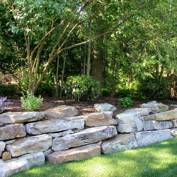 OUTCROPPING WALL AND PLANTINGS