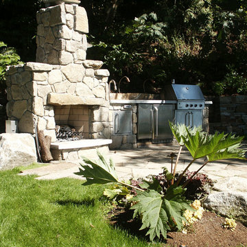 Outdoor kitchen and fireplace with native, drought-tolerant plantings