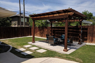 Inspiration for a contemporary privacy backyard concrete paver landscaping in Dallas.