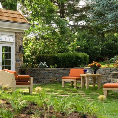 Inspiration for a mid-sized traditional shade backyard stone landscaping in Philadelphia.