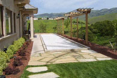 Inspiration for a large traditional full sun backyard stone landscaping in San Francisco.