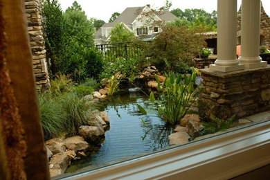 Photo of a traditional side yard water fountain landscape in Atlanta.