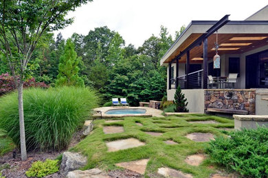 This is an example of a mid-sized modern backyard stone landscaping in Orange County.