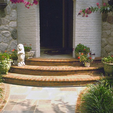 Painted Brick Entryway w Arch, Steps and Bordered Stone Walkway