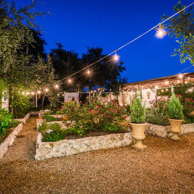 Inspiration for a large farmhouse full sun backyard mulch formal garden in Austin.