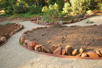 Inspiration for a medium sized classic back formal garden in Sacramento with a garden path and gravel.