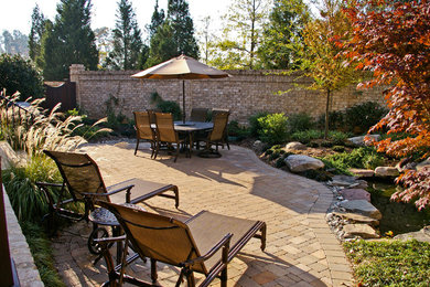 Photo of an asian partial sun courtyard stone water fountain landscape in Raleigh for fall.