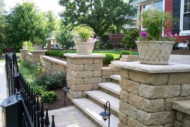 Inspiration for a traditional front yard retaining wall landscape in Indianapolis.