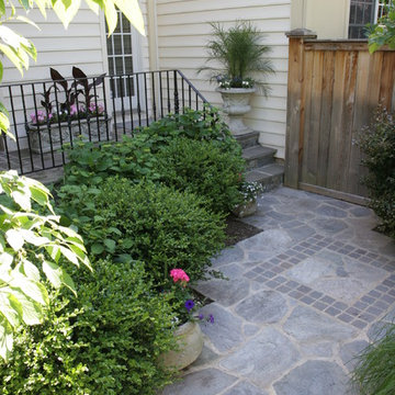 Patterned Stone Walkway with Compact Garden Beds