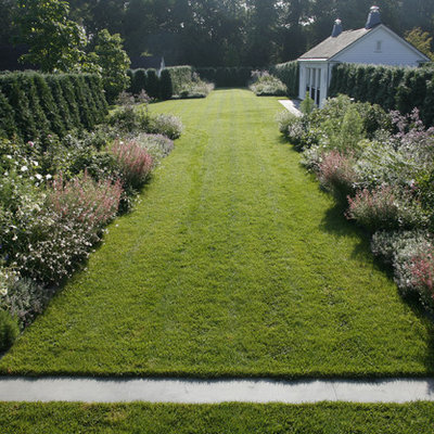 Design ideas for a large traditional backyard formal garden in New York.