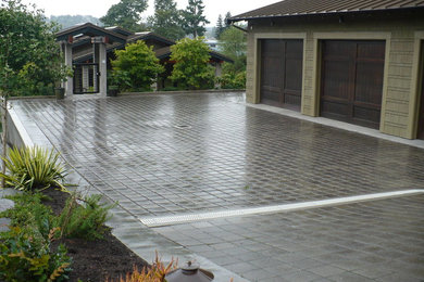Photo of a front yard concrete paver driveway in Seattle.