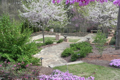 Design ideas for a traditional full sun side yard formal garden in Other for spring.