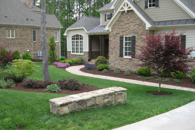 Design ideas for a mid-sized traditional partial sun front yard concrete paver landscaping in Raleigh.
