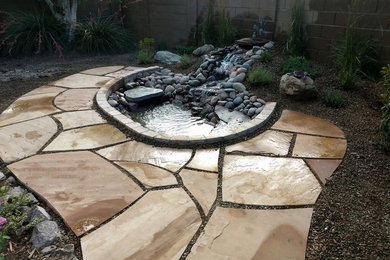 This is an example of a mid-sized traditional backyard landscaping in Phoenix.