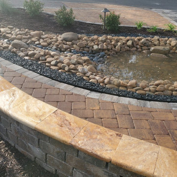 Pond Waterfall, Seating Wall, Travertine cap, and artificial turf