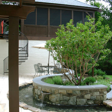 Pond with Flagstone Wall, Pergola and Curved Iron Handrail
