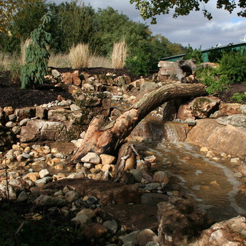 Pondless Waterfall using Weathered Limestone Built in Crescent. IA