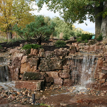 Pondless Waterfall using Weathered Limestone Built in Crescent. IA