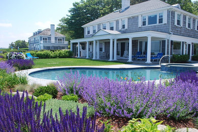 Design ideas for a traditional full sun backyard landscaping in Boston.
