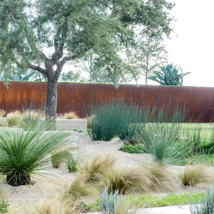 This is an example of an industrial xeriscape in Austin with gravel.