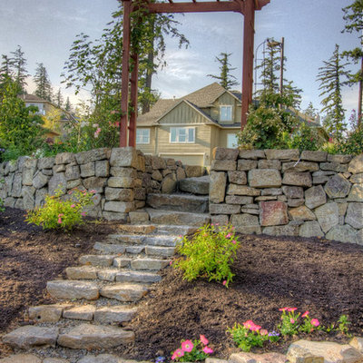 Inspiration for a traditional hillside stone landscaping in Portland.