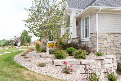 Design ideas for a large contemporary full sun and drought-tolerant side yard retaining wall landscape in Other for summer.