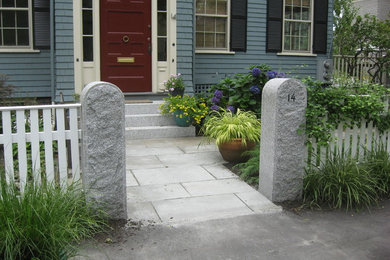Photo of a mid-sized traditional shade front yard stone garden path in Boston for summer.