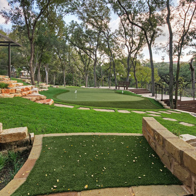 Design ideas for a large traditional shade front yard stone landscaping in Austin for spring.