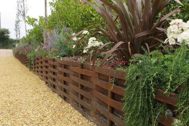 Raised beds and border can be created using our woven steel fencing or solid ste