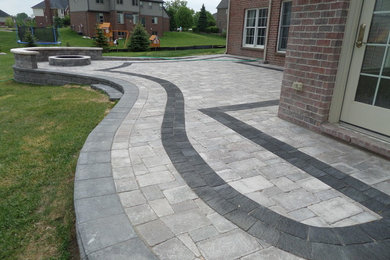 Raised Patio made with Unilock's Pisa Wall, Brussels and lL Campo Pavers