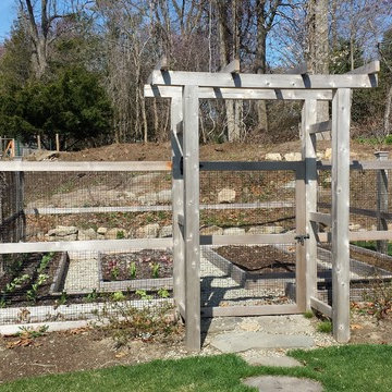 Raised vegetable beds with pea gravel paths provide easy access to all areas of