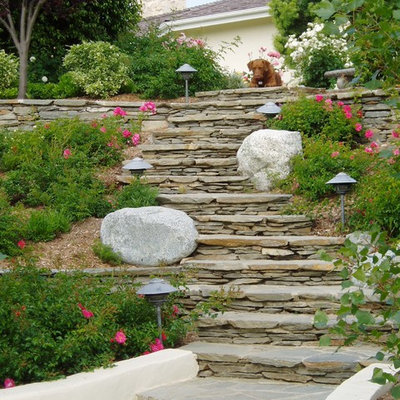Photo of a traditional full sun hillside stone retaining wall landscape in San Diego.