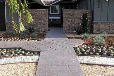 This is an example of a mid-sized contemporary front yard concrete paver landscaping in Santa Barbara.