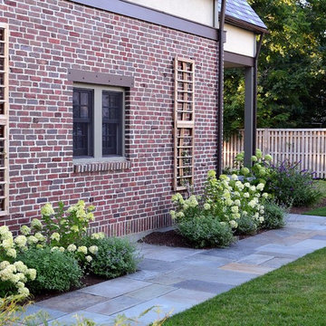 Red cedar trellis with climbing clematis and hydrangea.