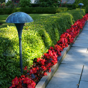 Red Flowers with Boxwood Hedges
