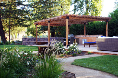 Redwood pergola and outdoor kitchen/dining area