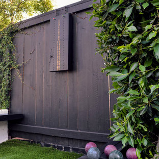 Photo of a large mediterranean full sun side yard landscaping in Los Angeles with decking.