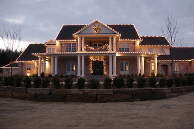 This is an example of a large contemporary front yard landscaping in Other for winter.