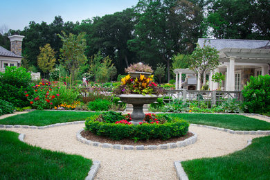 This is an example of a large traditional full sun backyard gravel water fountain landscape in New York.