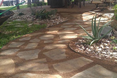 Design ideas for a mid-sized traditional drought-tolerant and full sun backyard stone garden path in Austin for spring.