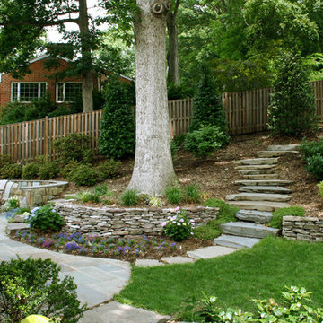 Retaining Wall with Stone Path on Sloped Backyard