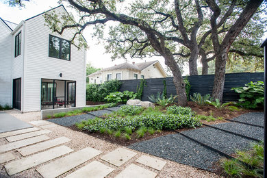 Design ideas for a contemporary partial sun front yard gravel garden path in Austin for fall.