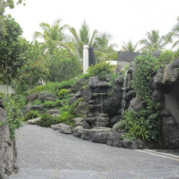 Rock waterfall and pond in the front yard