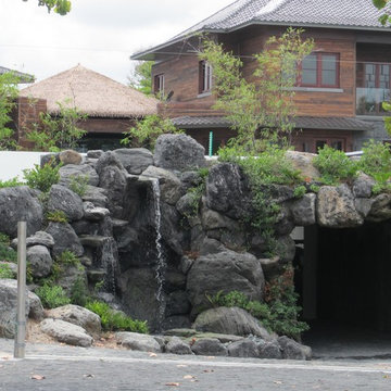 Rock waterfall and tunnel in the front yard