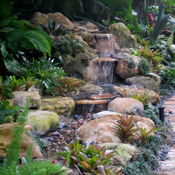 Rock waterfall tropical garden pond