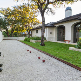 Design ideas for a mid-sized mediterranean partial sun side yard gravel landscaping in Austin for spring.