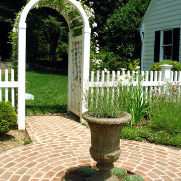 Rose Trellis with White Picket Fence and Garden Path