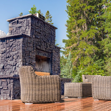 Rundle Stone Fireplace With Flagstone & Composite Decking Seating Area