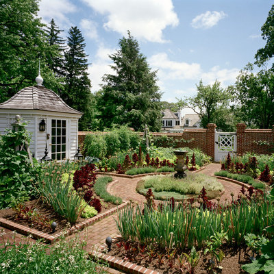 Inspiration for a large farmhouse full sun courtyard brick landscaping in New York.